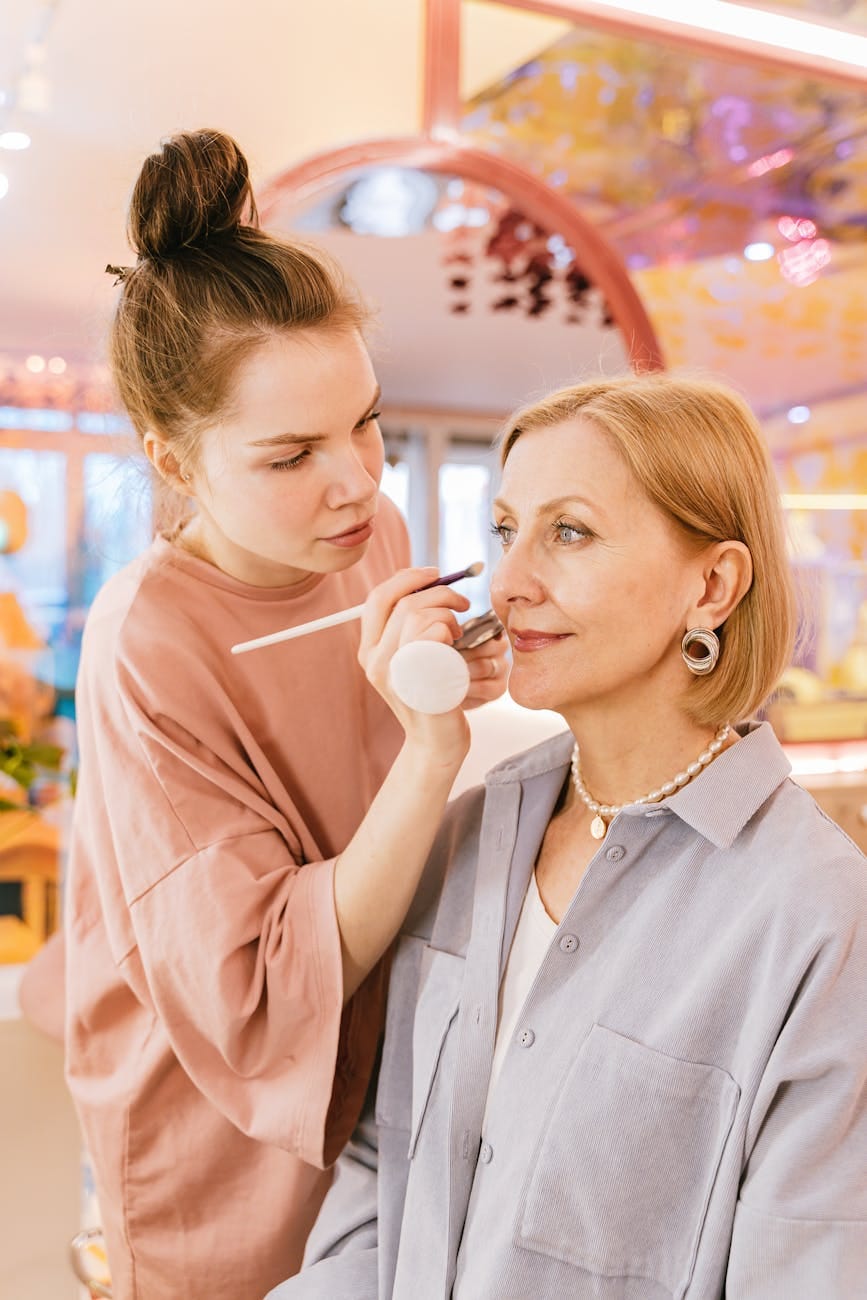 a makeup artist working on a client