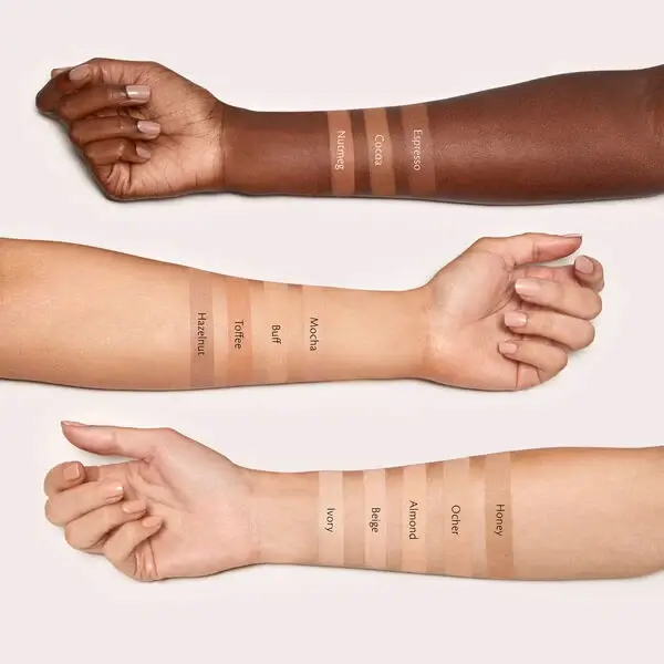 Clé de Peau Beauté Concealer arm with shades