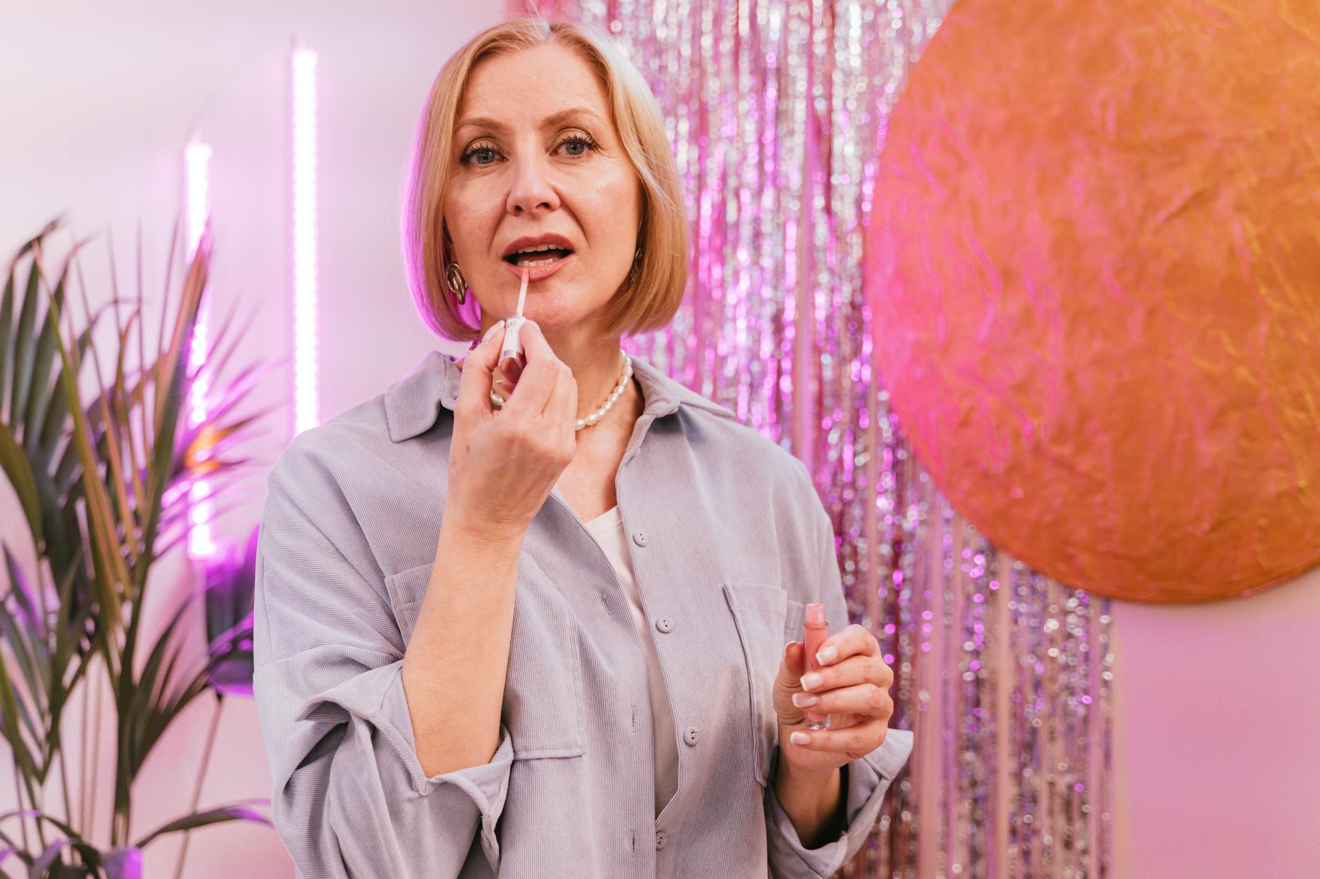 a mature woman applying primer