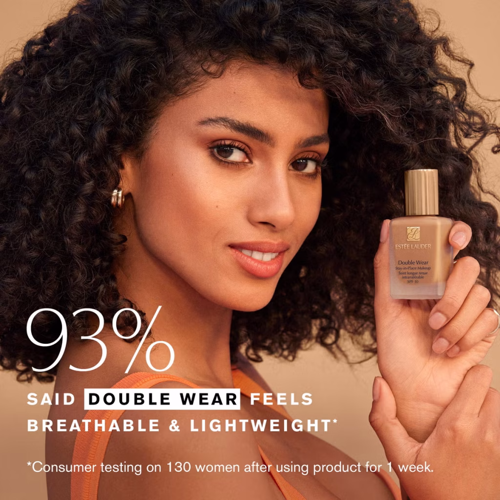 girl holding Estée Lauder Double Wear Stay-in-Place Makeup