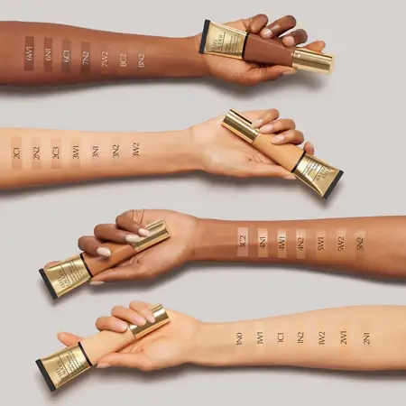 Tube of Estée Lauder Futurist Hydra Rescue lying flat on a vanity tray with soft natural lighting.