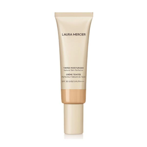 Laura Mercier Natural Skin Perfector tinted moisturizer SPF 30 tube and blur-effect swatches on arms for line-smoothing on aging skin