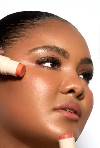 Cream blush and bronzer swatches on cheek, depicting cream blushes and bronzers for youthful flush on hydrating mature skin.