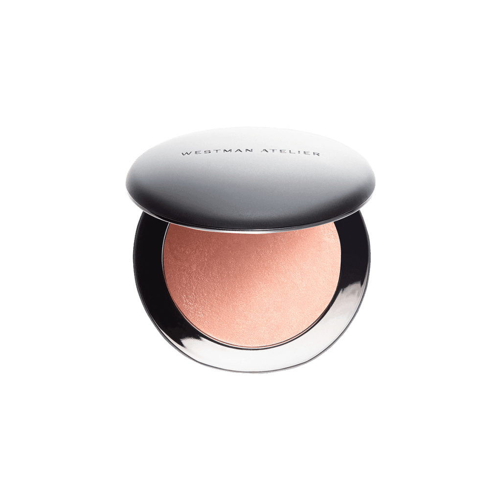 A round compact of peach-colored blush with a shiny silver lid labeled Westman Atelier, shown open against a plain white background.