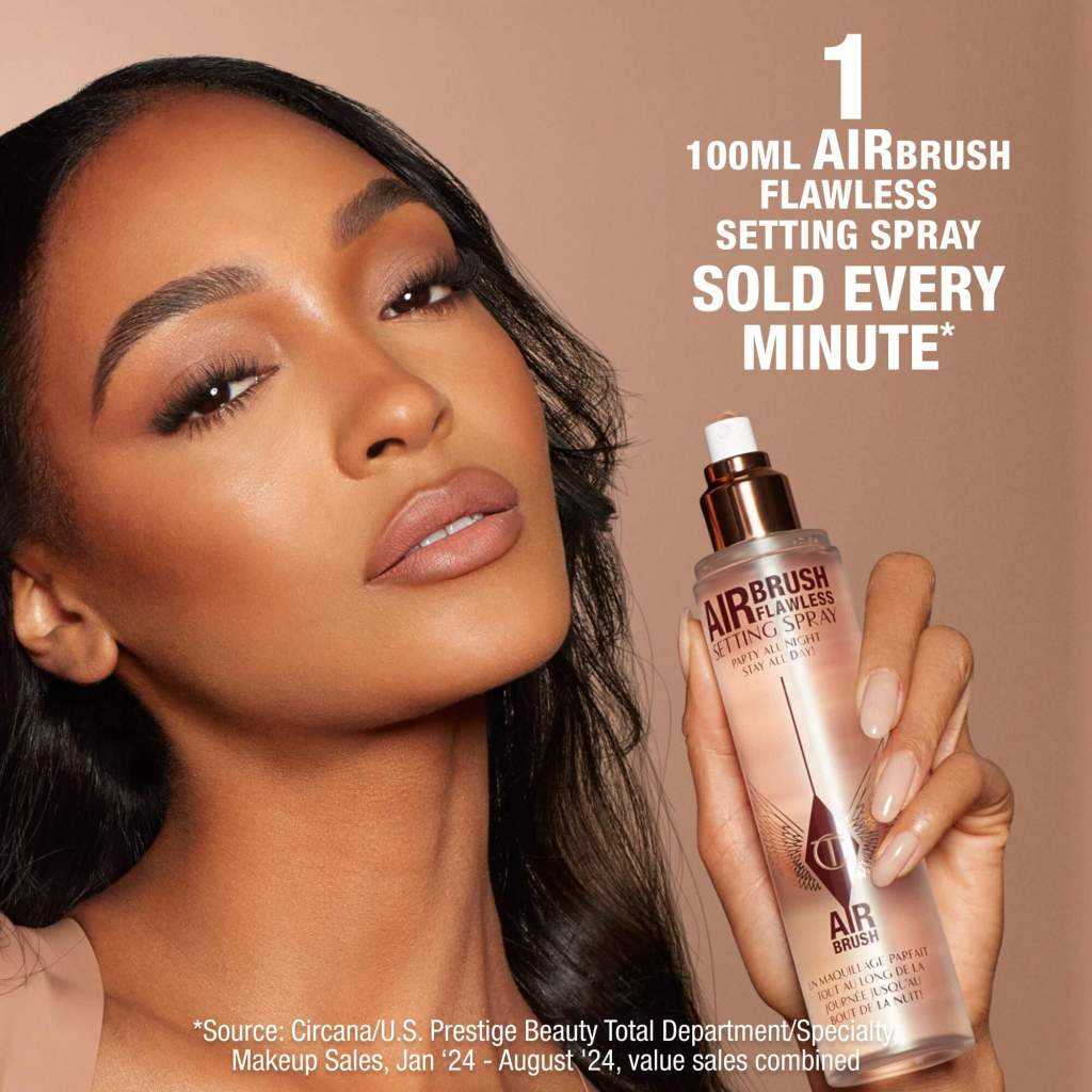 Beautifull woman holding Charlotte Tilbury Airbrush Flawless Setting Spray: saying 1 airbrush is sold every minute