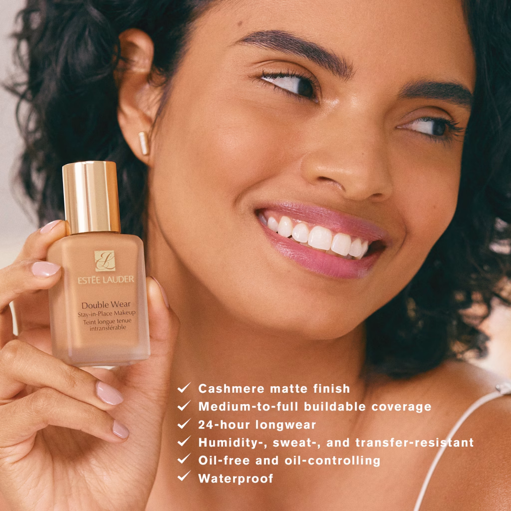 Smiling woman wearing Estée Lauder Double Wear foundation with a natural, flawless finish.