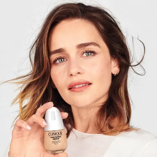 Model holding Clinique bottle