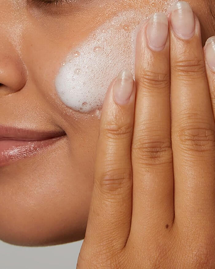 Official CeraVe image showing cream-to-foam cleanser lather on skin